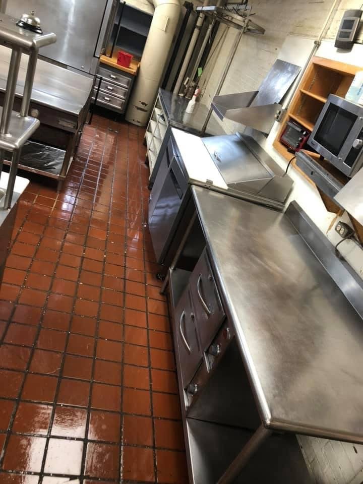 Same commercial kitchen after deep cleaning, tile and grout fully restored
